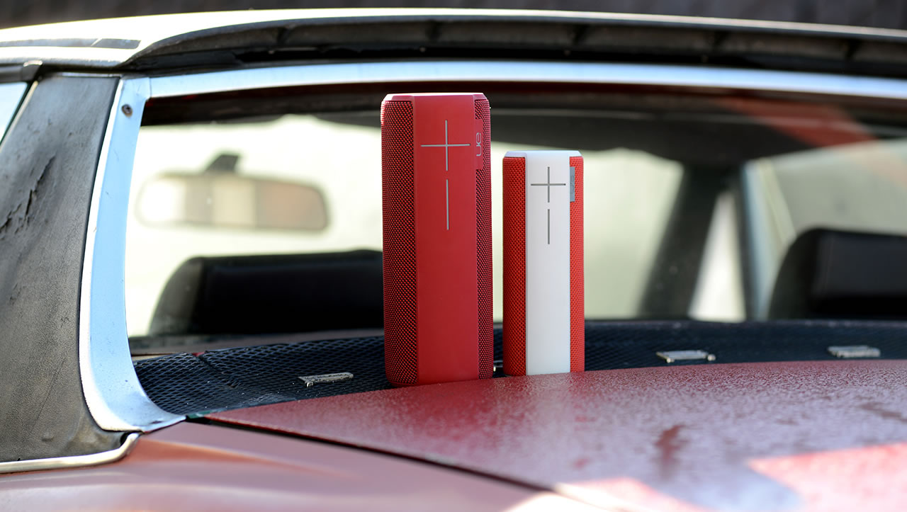 UE Boom and Megaboom mobile speakers on the car