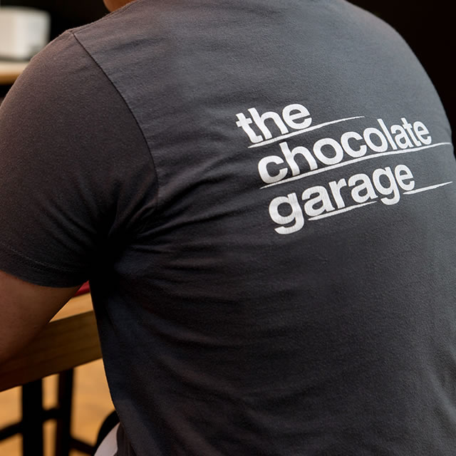 The Chocolate Garage logo on a t-shirt