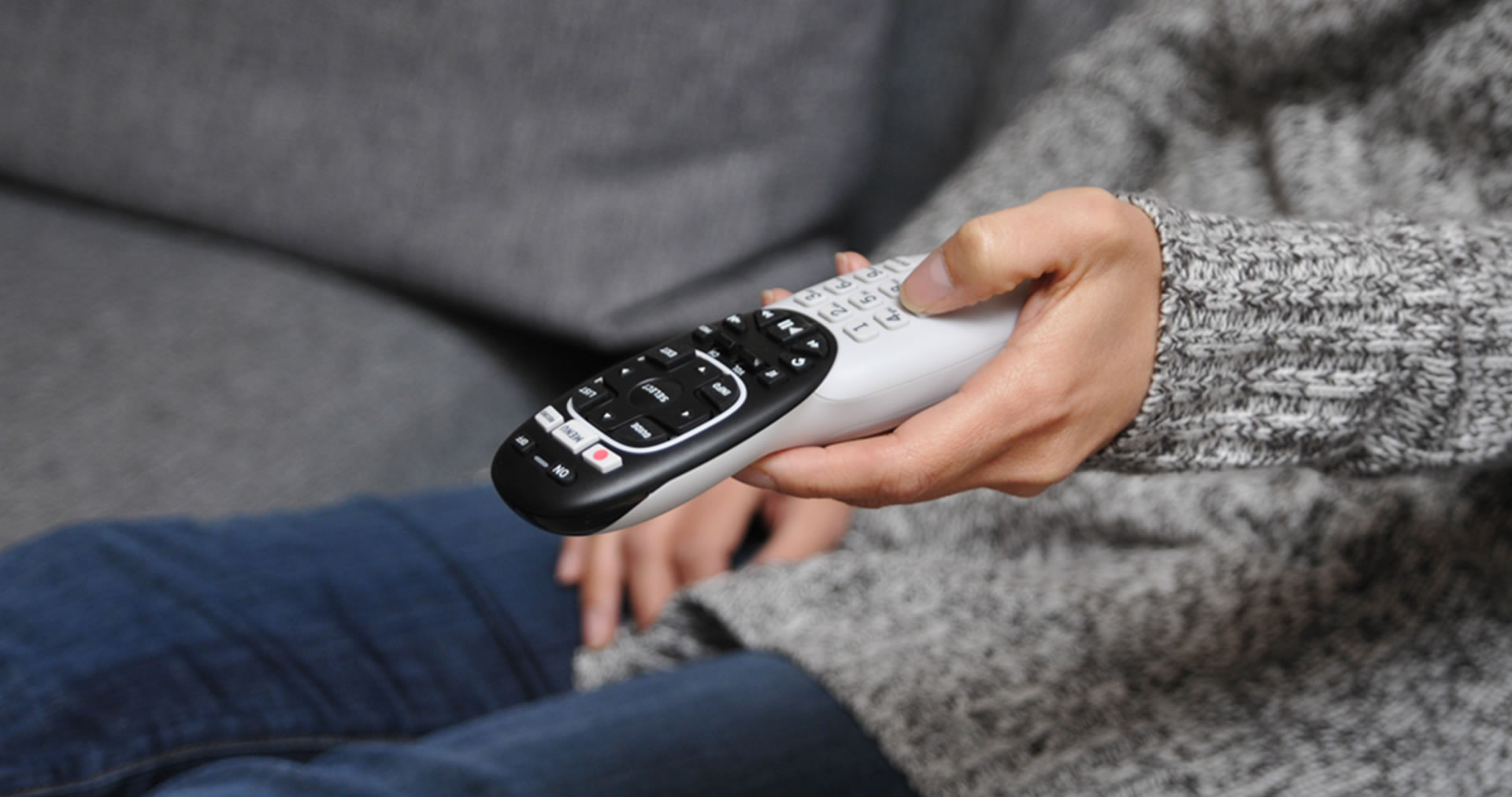 DirecTv remote control in hand