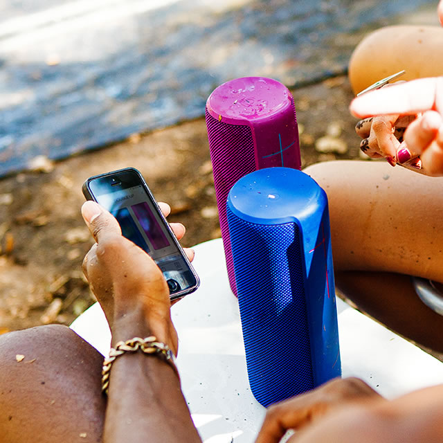Blue and purple UE Megaboom mobile speakers with phone app