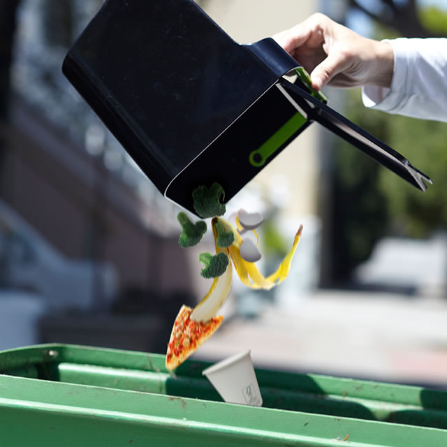 Black Untrash composting can emptying food scraps