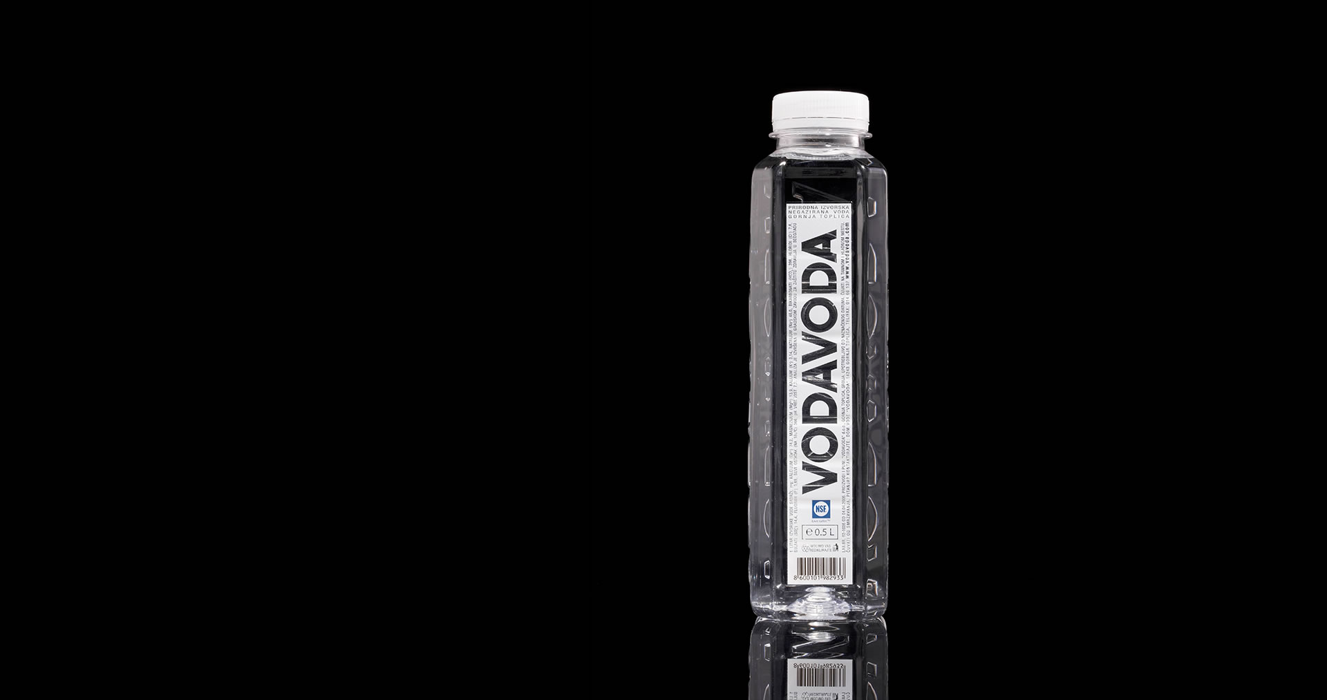 Vodavoda water bottle on black background